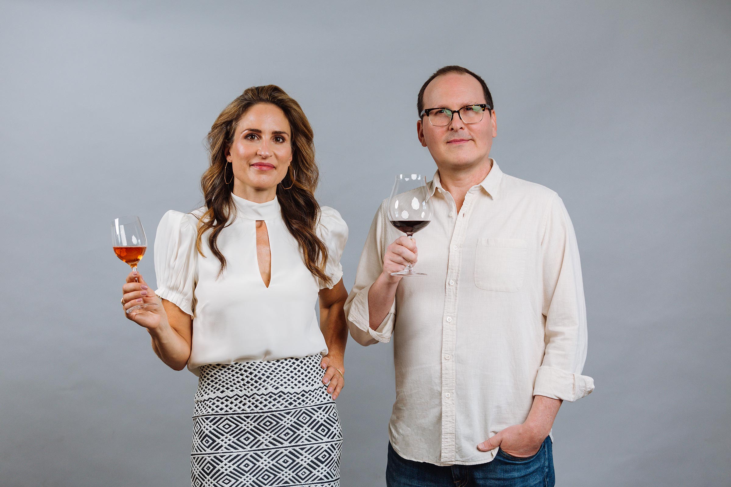 Katherine and Jon holding wine glasses